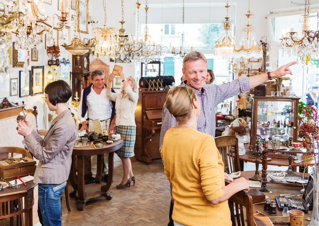 Shoppers and staff on the floor of an antique mall