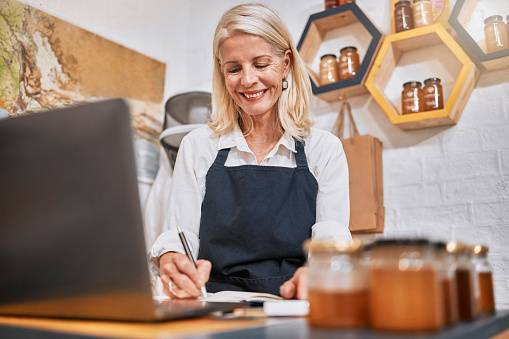 Shop owner reviewing the day's numbers