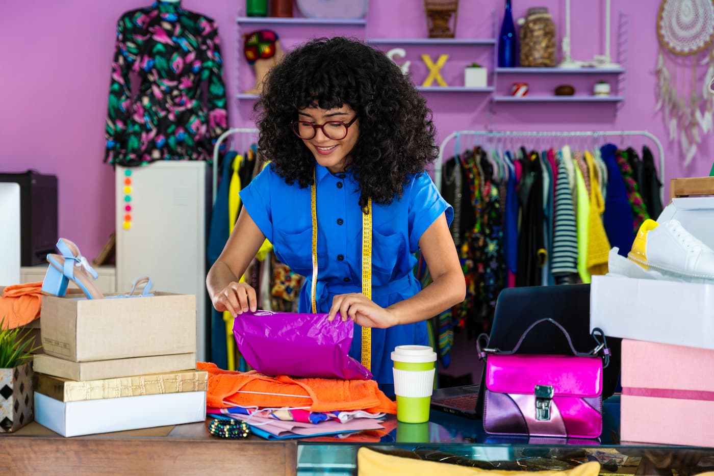 Boutique owner packing clothes for a customer